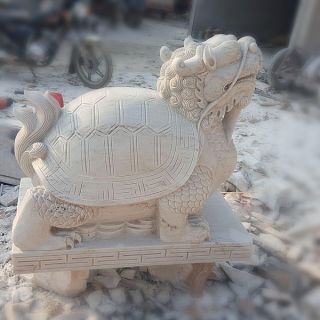 晚霞紅風水龍龜石雕是怎么制作出來的？